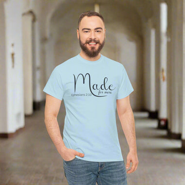 Man wearing a gray t-shirt with 'Made for more' text on a light heather grey background