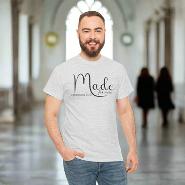 Man wearing a gray t-shirt with 'Made for more' text on a light heather grey background