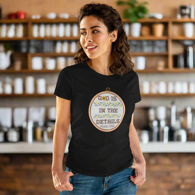Woman wearing a black t-shirt with a motivational quote on a beige background