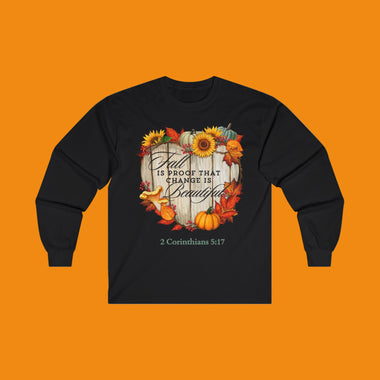Black long-sleeve tee shirt with autumn-themed design says "Fall is Proof that Change is Beautiful"
