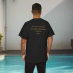 Black t-shirt with John 1:12 text on the back worn by a person