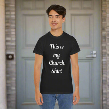 Person wearing a black t-shirt with 'This is my Church Shirt' text