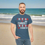 Man wearing a blue t-shirt with text and a cross on a white background