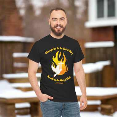 Man wearing a gray t-shirt with a dove, cross and flame design and text in orange