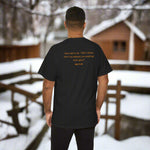 Person wearing a black t-shirt with text of John 11:40on the back