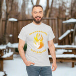 Man wearing a gray t-shirt with a dove, cross and flame design and text in orange