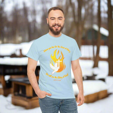 Man wearing a gray t-shirt with a dove, cross and flame design and text in orange