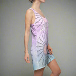 Woman wearing a sleeveless dress with Grace Upon Grace text design