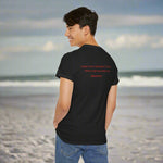 Person wearing a black t-shirt with red text of Psalm 51:10 on the back