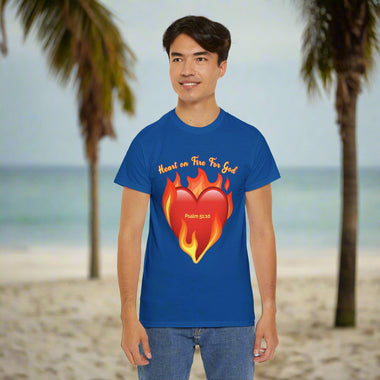 Person wearing a gray t-shirt with a red heart and flame design and Heart of Fire for God text