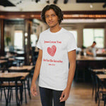 Person wearing a gray t-shirt with red   text Jesus Loves You But I'm His Favorite and heart graphic