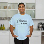 Man wearing a Light Blue t-shirt with 'Forgiven & Free' text kitchen background