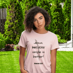 Person wearing a pink t-shirt with text , "Jesus, because life is better" on a plain background