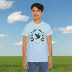 Person wearing a light blue t-shirt with a black dove and leaves