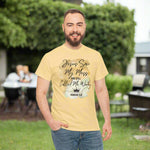 Man wearing a yellow t-shirt with Jesus Saw My Mess and still Called Me Worthy Romans 5:8 on the front