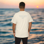 Man wearing a beige t-shirt with text on the back of Jonah 2:2